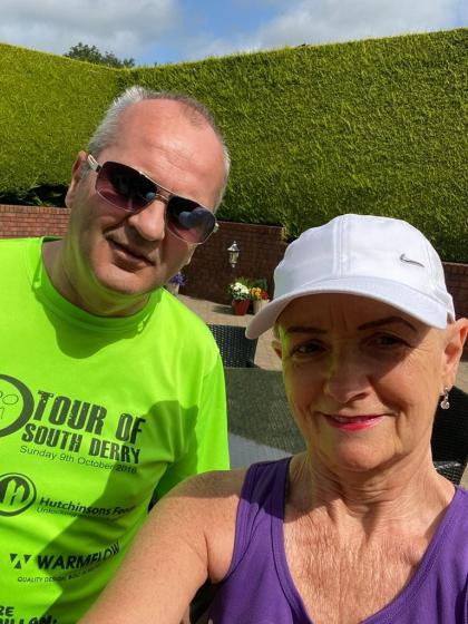 Pauline wearing a cap about to go out walking with her husband