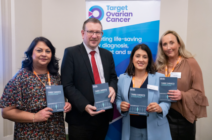 A photo of Sbba, Reeta and Natalie, Target Ovarian Cancer campaigners, with Andrew Gwynne MP all holding up our Three Targets agenda