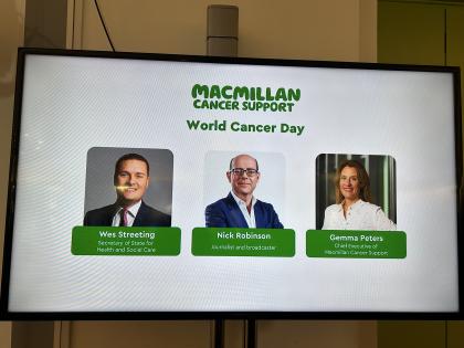 A screen showing the speakers from the World Cancer Day event - Wes Streeting, Nick Robinson and Gemma Peters 