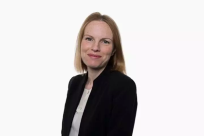 Sonya Branch is pictured wearing a smart black jacket and smiling at the camera