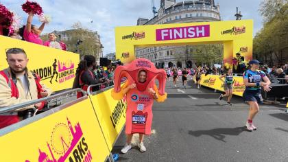 Lisa dressed in her ovary mascot outfit at the finish line of the London Landmarks Half Marathon